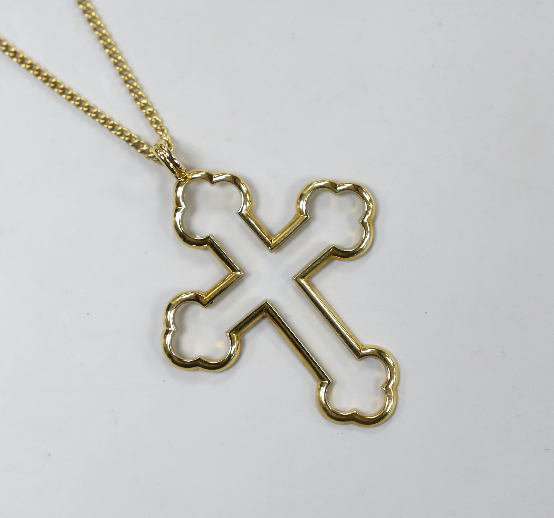 A modern 18ct gold Advalorem(for the V&A Museum in London) cross pendant, influenced by the designs of Pugin,46mm, on an 18ct gold chain, 39cm, 8.4 grams.